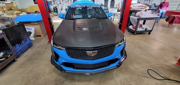 Unpainted fiberglass hood with vents