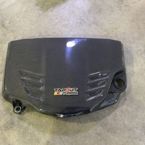 Slightly used OEM carbon fiber engine cover with Tapout logo and mounting hardware installed